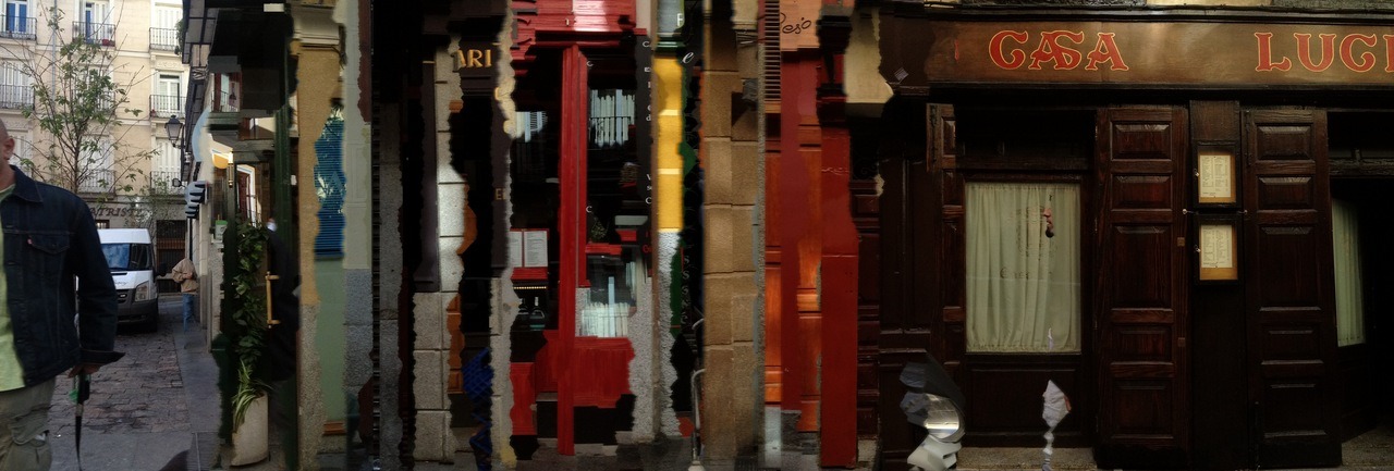 Glitchy panoramic photo of shop fronts